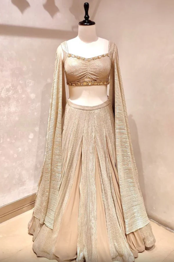 Metallic gold lehenga with cape sleeves blouse