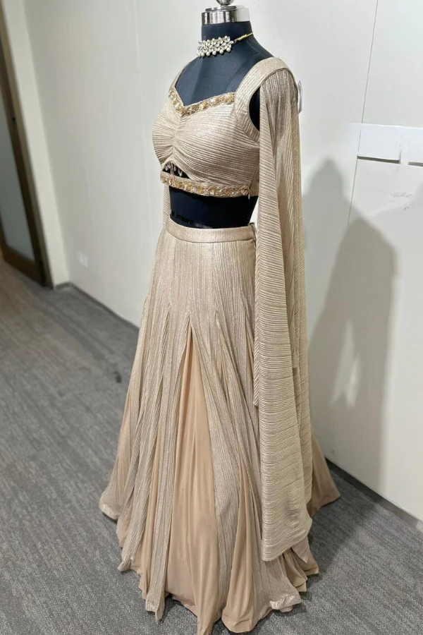 Metallic gold lehenga with cape sleeves blouse - Image 2